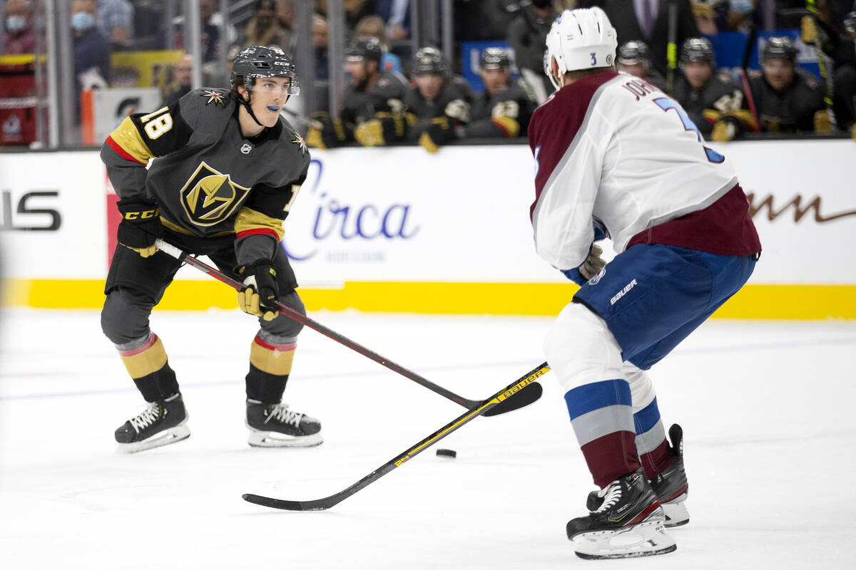 Golden Knights left wing Peyton Krebs (18) heads for the net guarded by Avalanche defenseman Ja ...