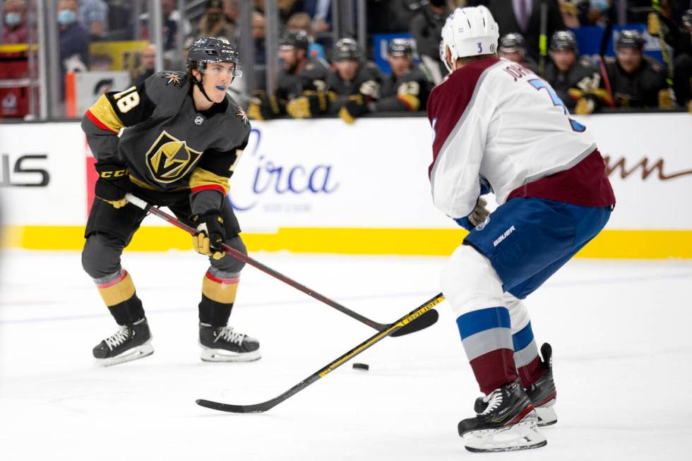 Golden Knights left wing Peyton Krebs (18) heads for the net guarded by Avalanche defenseman Ja ...