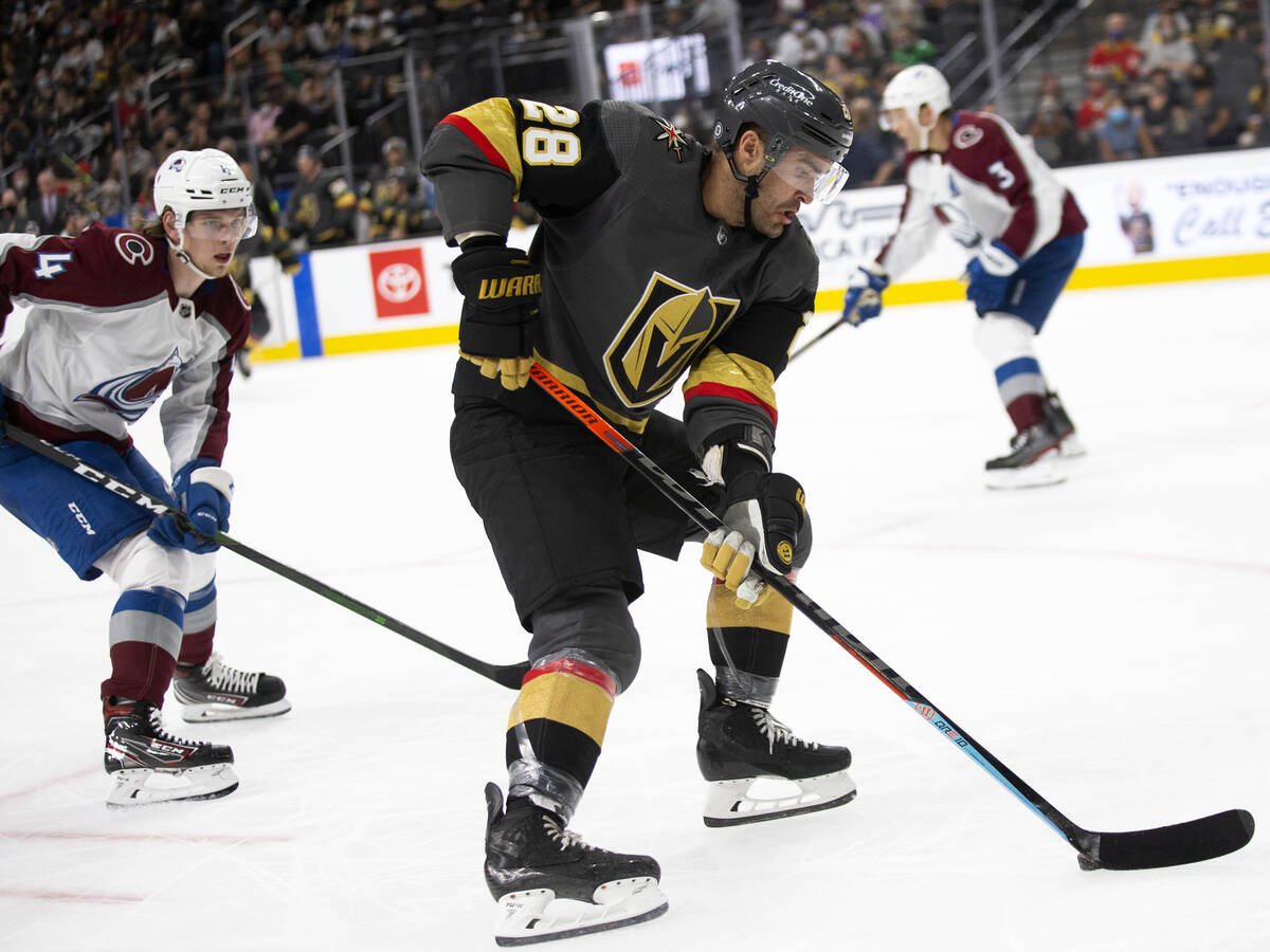 Golden Knights left wing William Carrier (28) gains control of the puck followed by Avalanche d ...