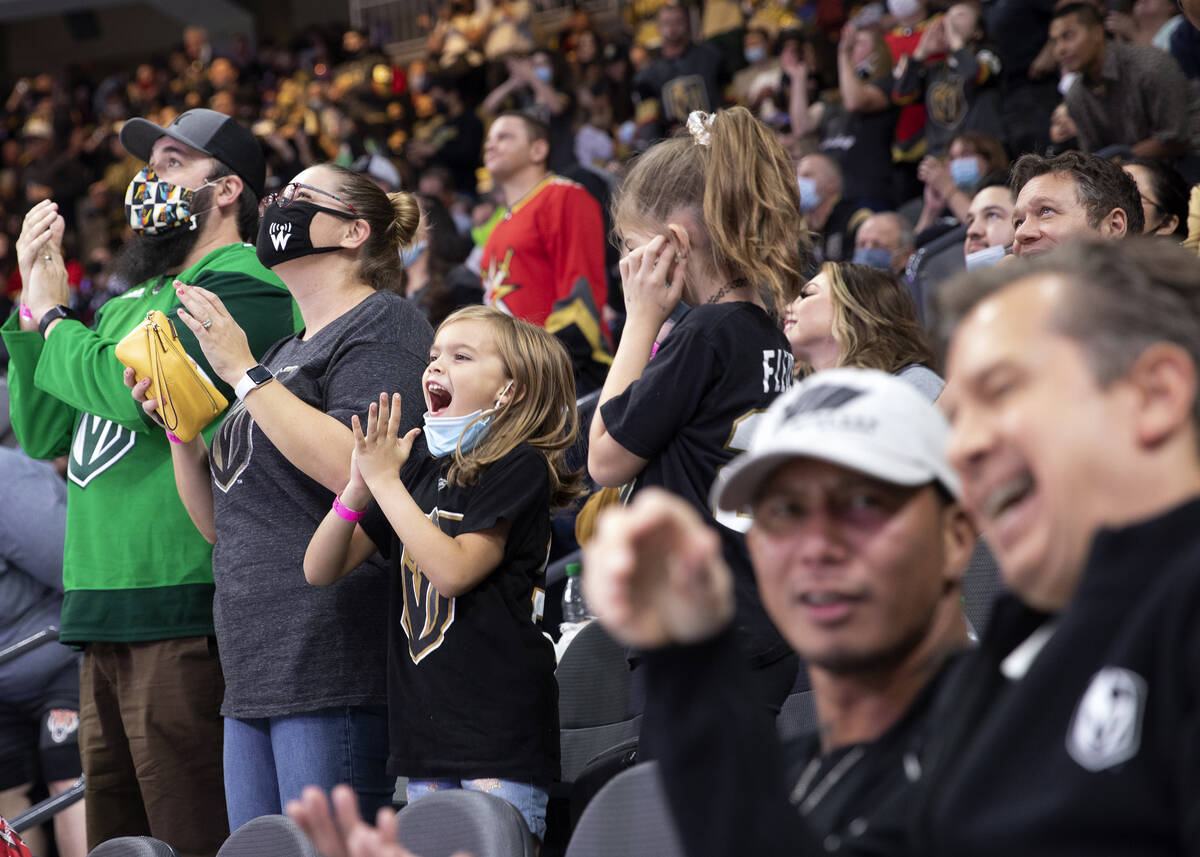 Golden Knights fans cheer as the team takes on the Avalanche during the first period of a prese ...