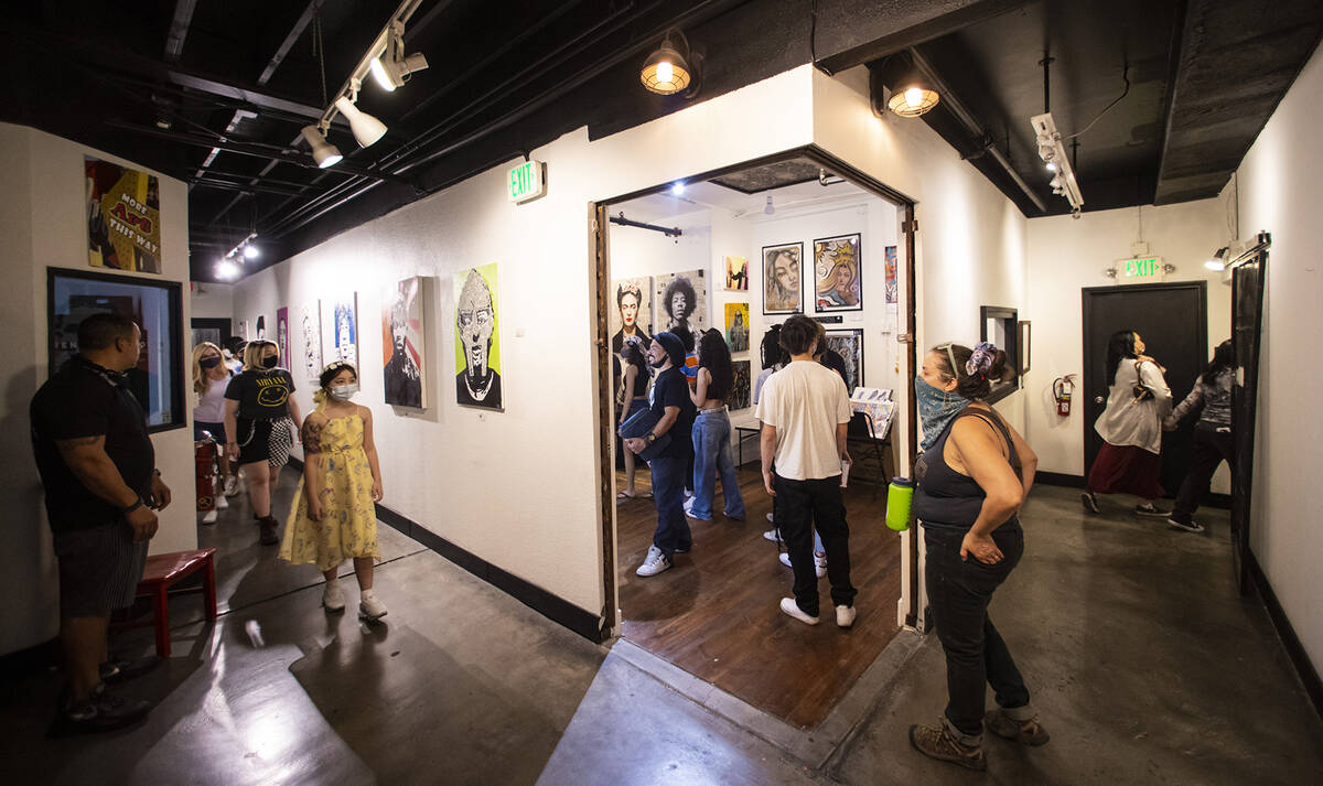 People walk through the Arts Factory during First Friday in the Arts District of downtown Las V ...