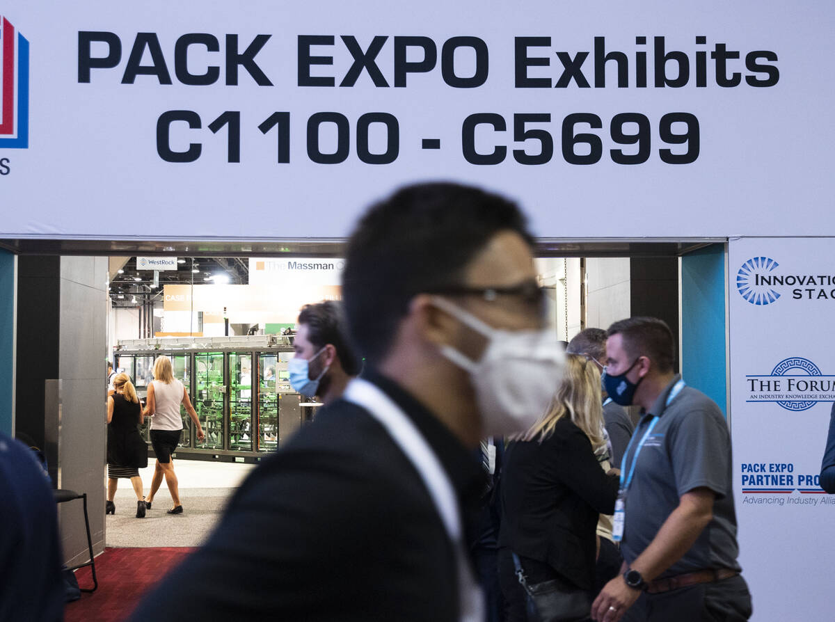 Expogoers arrive at the PACK EXPO, on Tuesday, Sep. 28, 2021, at the Las Vegas Convention Cente ...