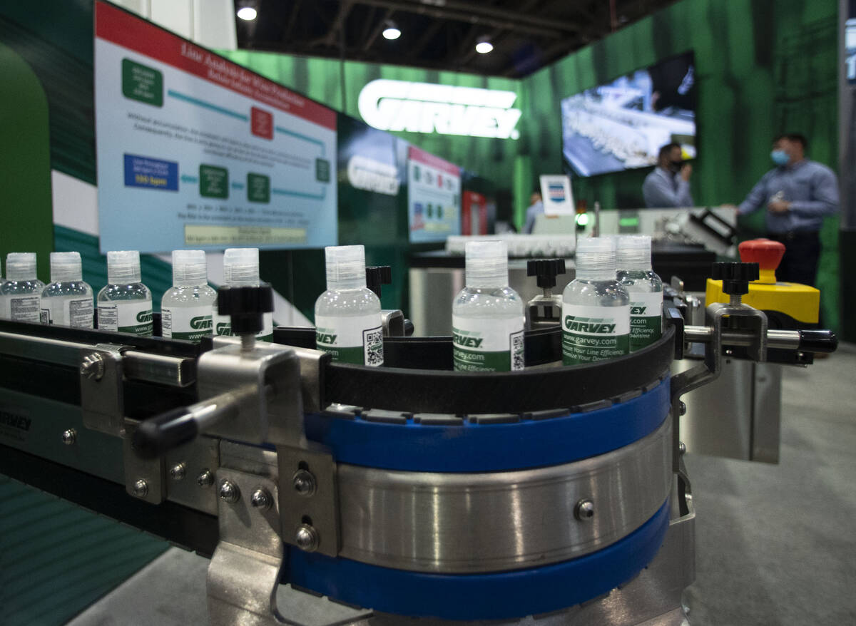 Plastic bottles slide on Garvey accumulator and conveyor machine during the PACK EXPO at the La ...