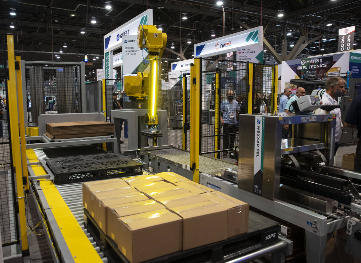 A BOX BOT QB300, a robotic palletizer, is displayed during the PACK EXPO at the Las Vegas Con ...
