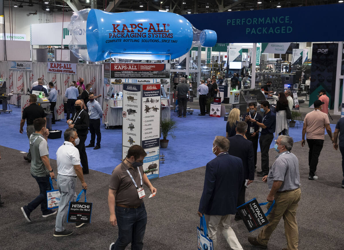 Expogoers arrive at the PACK EXPO, on Tuesday, Sep. 28, 2021, at the Las Vegas Convention Cente ...