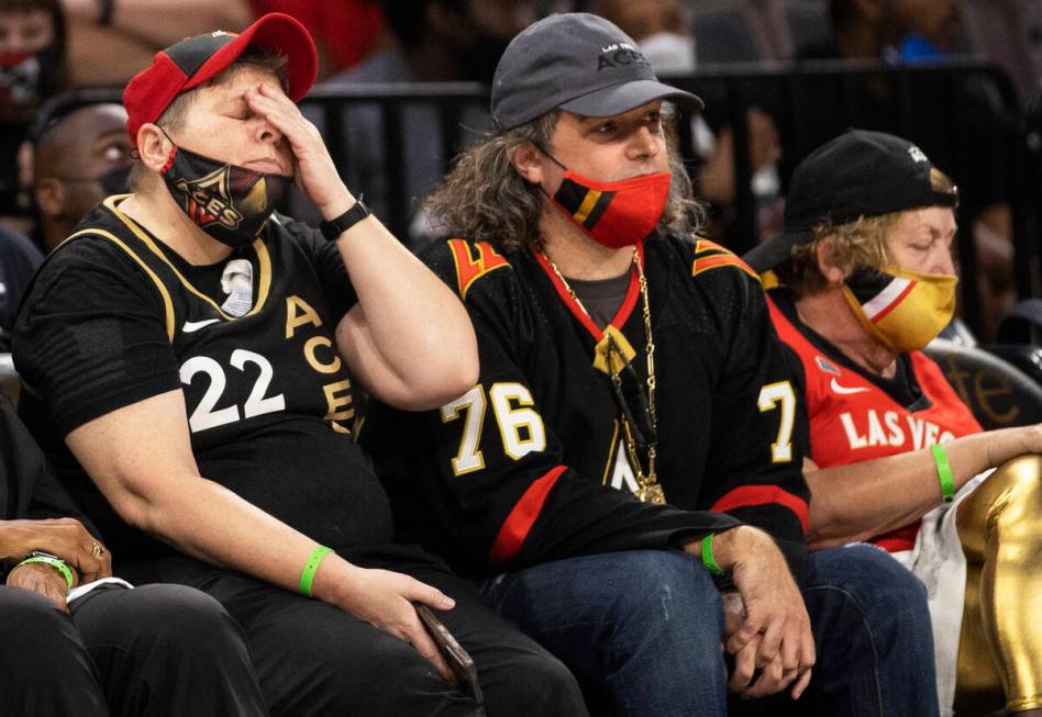 Las Vegas fans react to a bad play by the Aces in the first half of the WNBA semifinals against ...