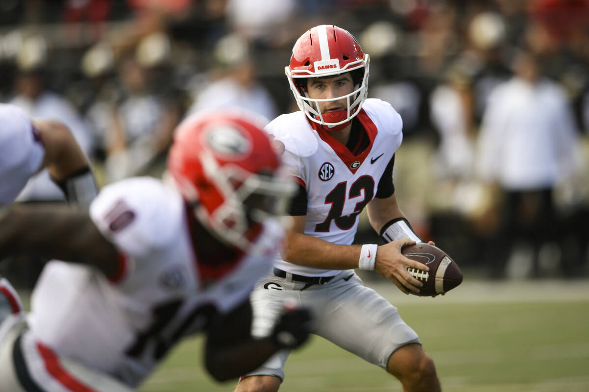 Georgia quarterback Stetson Bennett (13) plays against Vanderbilt during an NCAA college footba ...