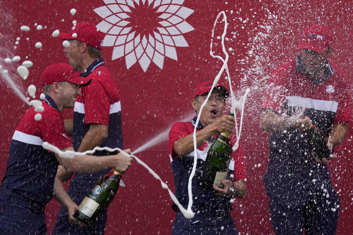 Team USA players celebrate after the Ryder Cup matches at the Whistling Straits Golf Course Sun ...
