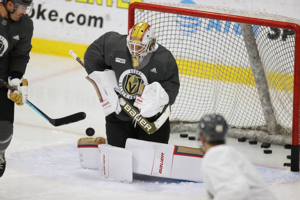 Vegas Golden Knights goaltender Laurent Brossoit (30) makes a stop during a team practice at Ci ...