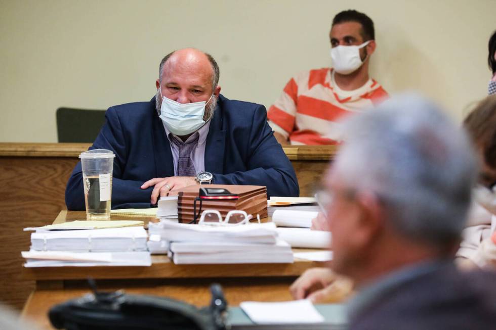 Attorney Jason Earnest listens to the prosecutor speak at a preliminary hearing for the alleged ...