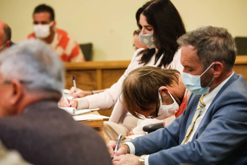 Brad Mehn, center, who with two others is charged with murder with a deadly weapon and kidnappi ...