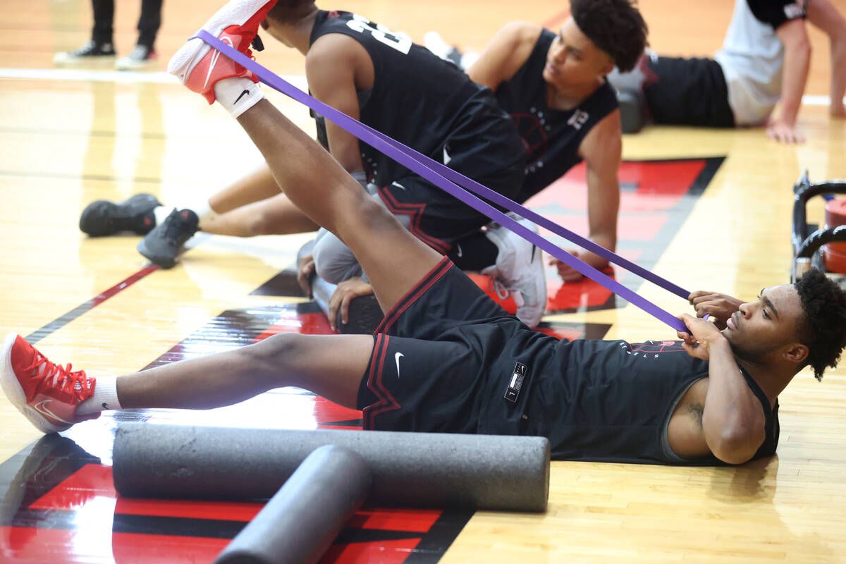 UNLV guard Bryce Hamilton stretches after practice at the Mendenhall Center in Las Vegas Wednes ...