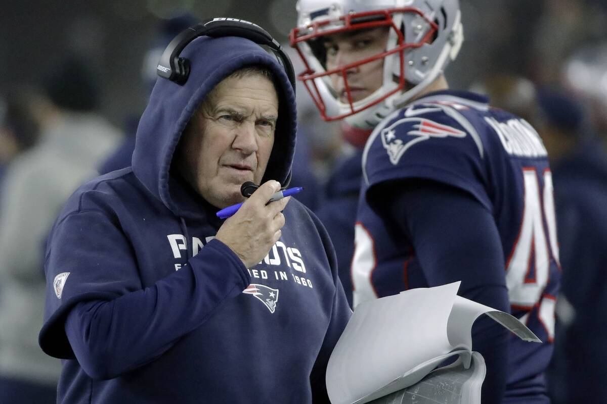 FILE - In this Jan. 4, 2020, file photo, New England Patriots coach Bill Belichick works along ...