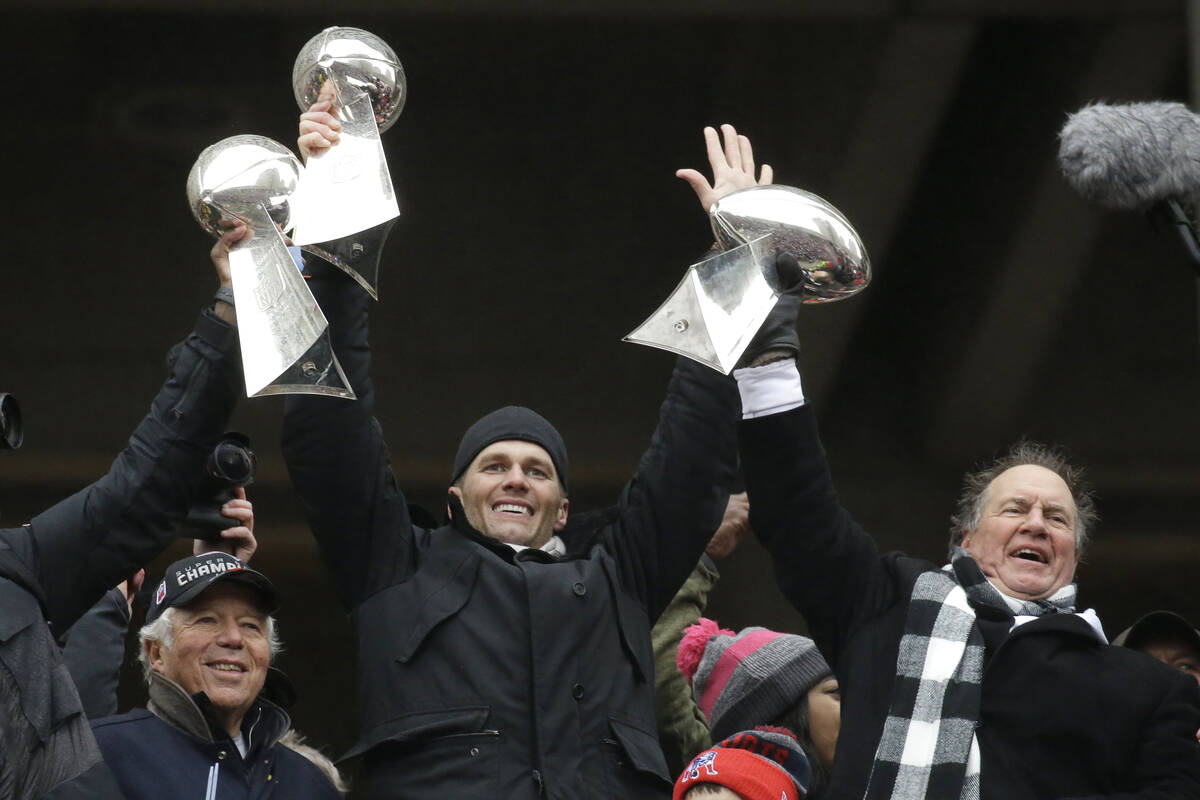 In this Feb. 7, 2017, file photo, New England Patriots quarterback Tom Brady holds up Super Bow ...