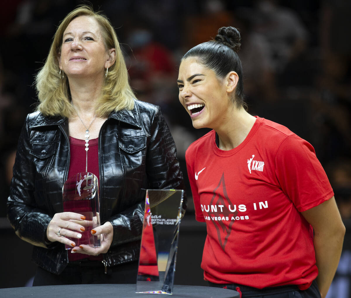 Cathy Engelbert, commissioner of the WNBA, stands next to Las Vegas Aces guard Kelsey Plum (10) ...