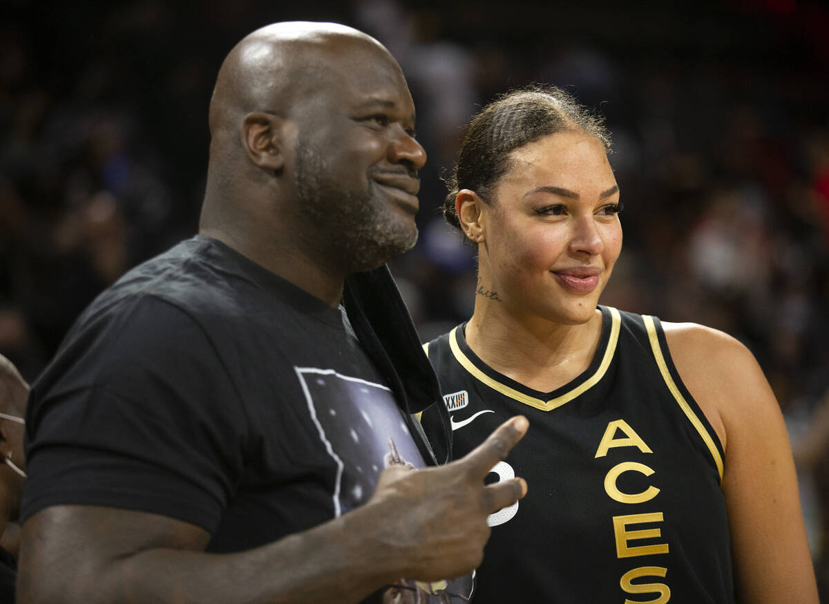 Las Vegas Aces center Liz Cambage (8) poses for photos with Shaquille O'Neal after game 2 of a ...