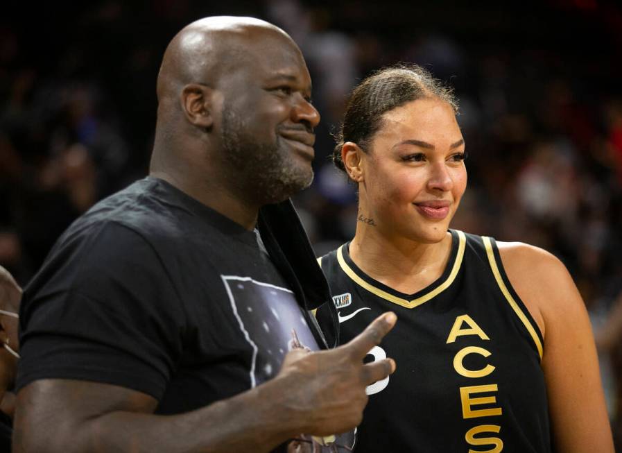 Las Vegas Aces center Liz Cambage (8) poses for photos with Shaquille O'Neal after game 2 of a ...
