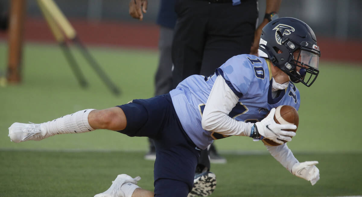 Foothill High School's Cole Reed (10) score a touchdown over Legacy High School during the firs ...