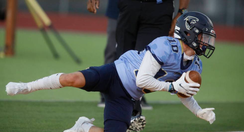 Foothill High School's Cole Reed (10) score a touchdown over Legacy High School during the firs ...