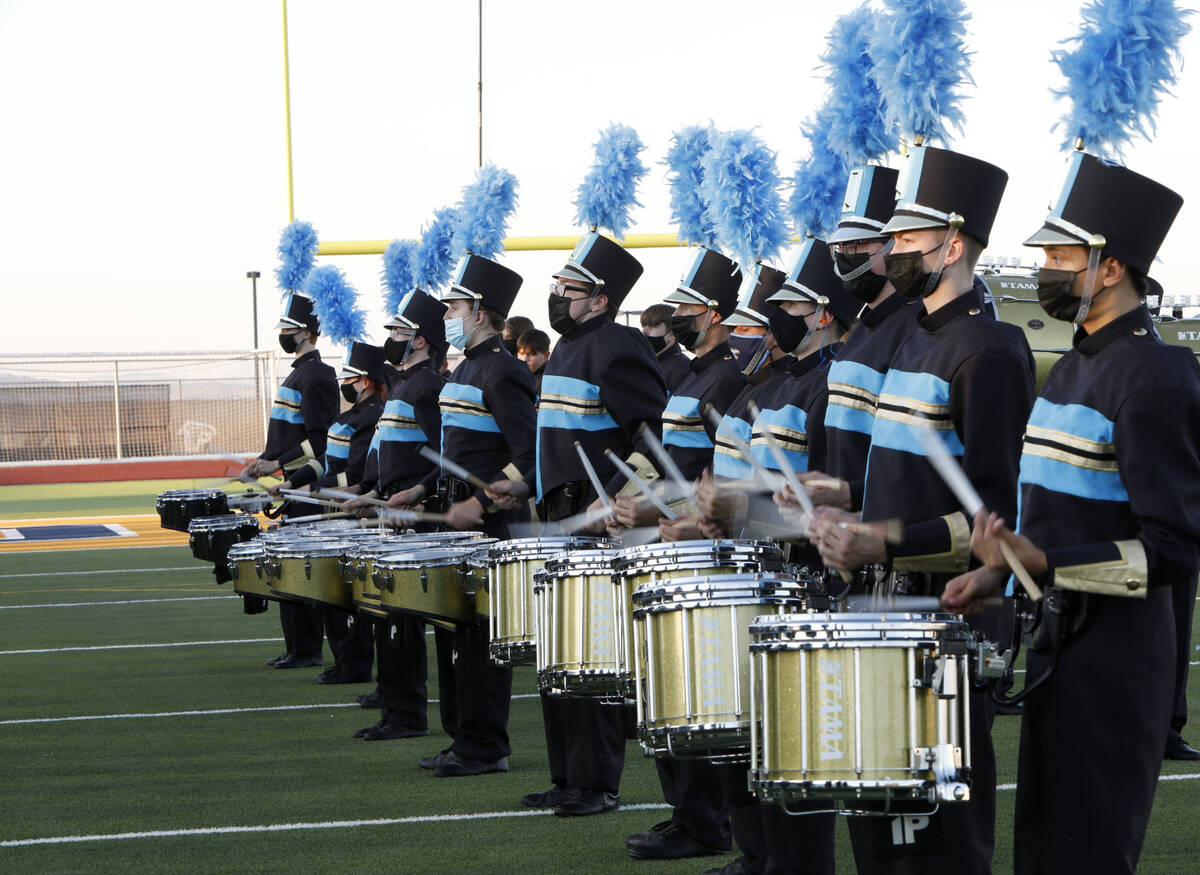 Foothill High School marching band members perform before a football game against Legacy High S ...