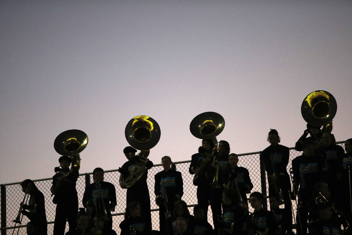 Foothill High School's marching band members perform during the first half of a football game a ...