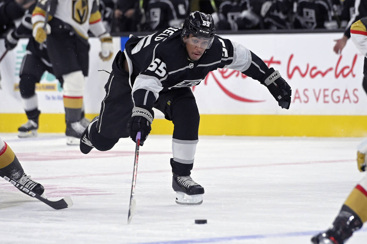 Los Angeles Kings center Quinton Byfield (55) reaches for the puck against the Vegas Golden Kni ...