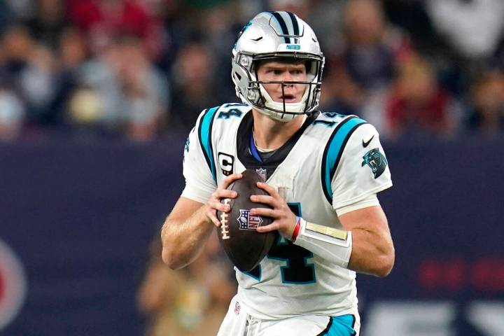 Carolina Panthers quarterback Sam Darnold (14) looks to pass during an NFL football game agains ...