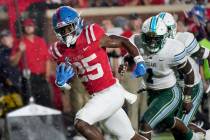 Mississippi running back Henry Parrish Jr. (25) runs past Tulane defenders on his way to a 19-y ...