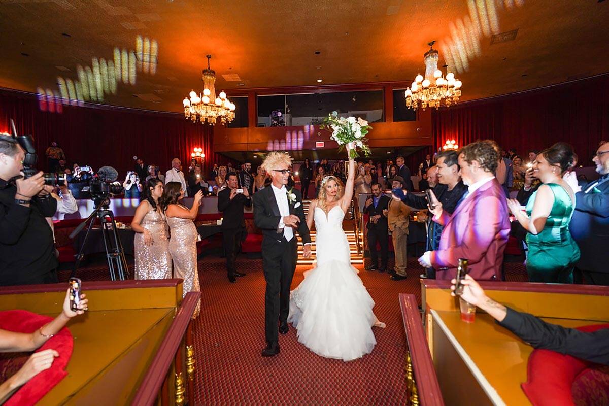 Murray Sawchuck and Dani Elizabeth walk down the aisle on their wedding day at the Plaza, Tuesd ...