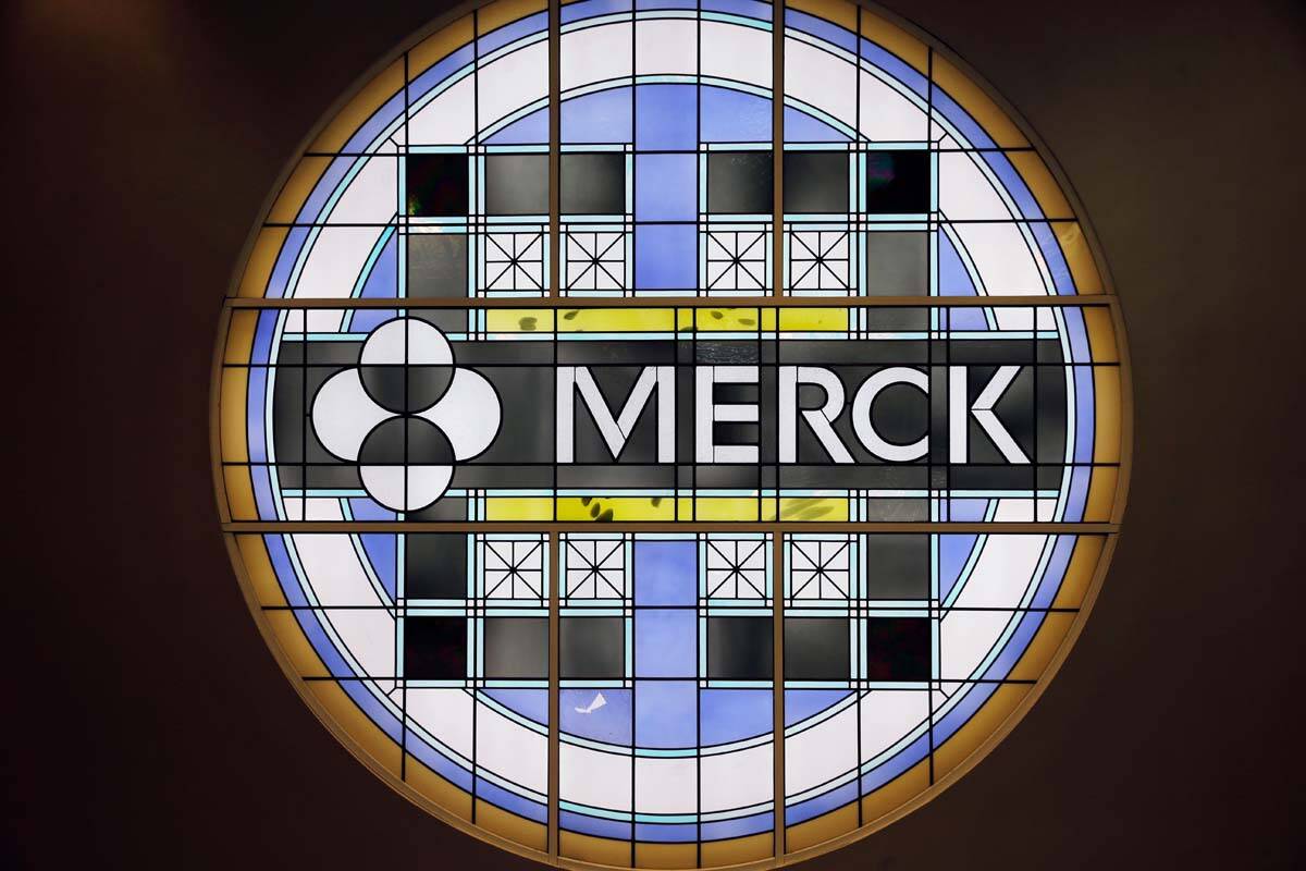 This Dec.18, 2014, file photo, shows the Merck logo on a stained glass panel at a Merck company ...