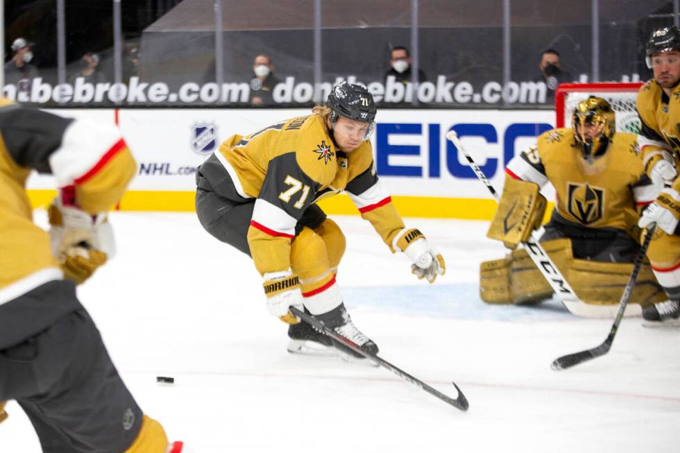 Golden Knights center William Karlsson (71) skates for the puck as Golden Knights goaltender Ma ...