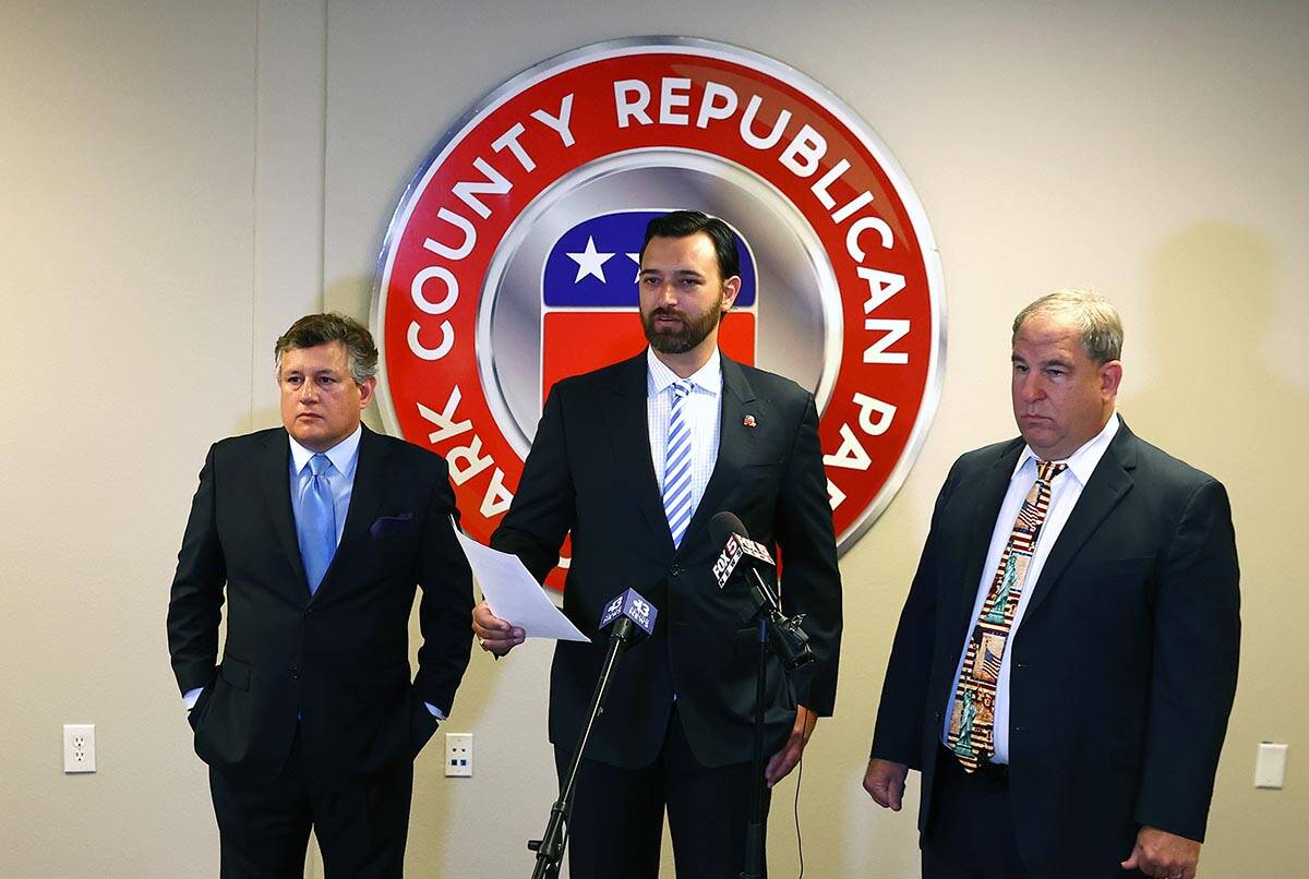 Clark County Republican Party Vice Chairman Stephen Silberkraus, center, speaks during a press ...