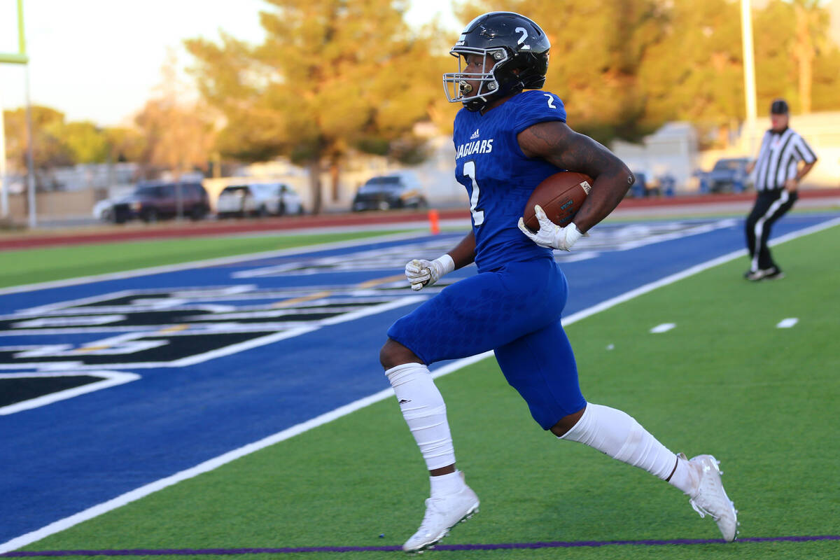 Desert Pines' Javontae Barnes (2) runs the ball for a touchdown in the first half of a football ...