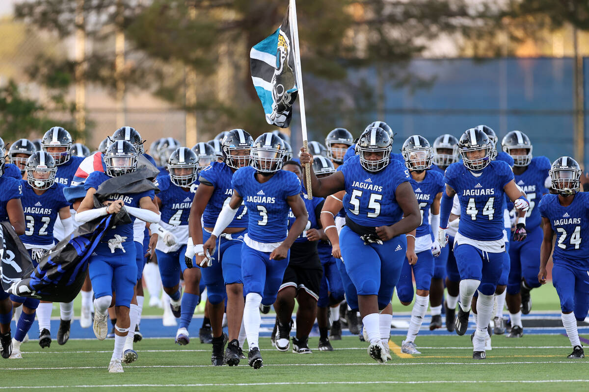 Desert Pines players take the field for their football game against Green Valley at Desert Pine ...