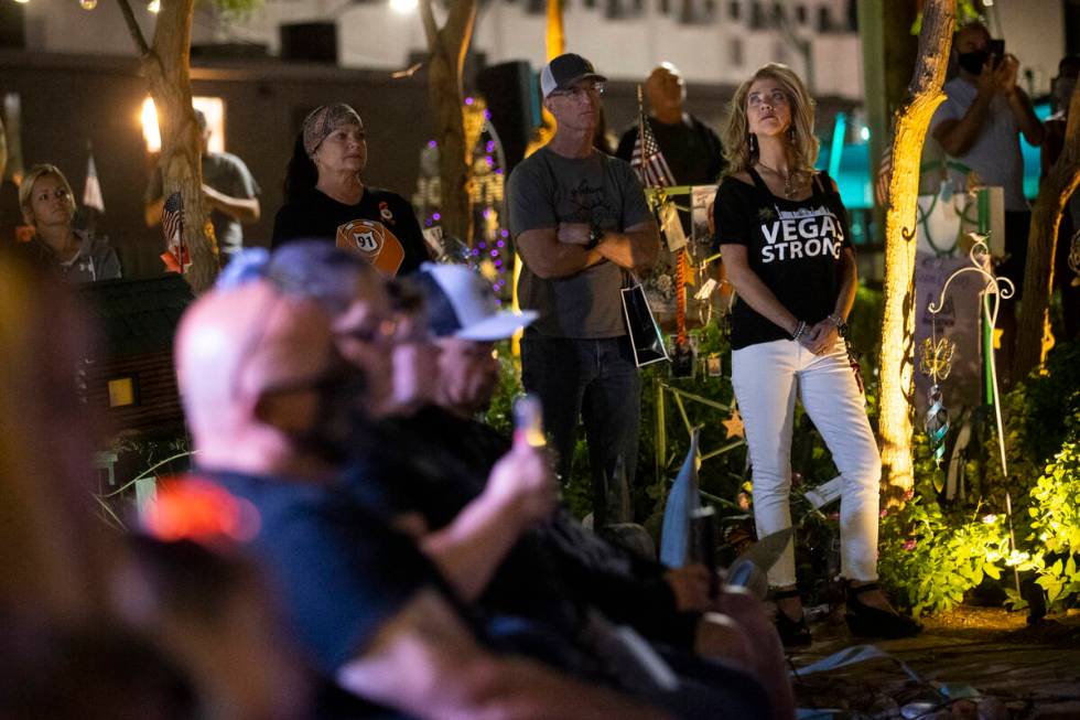 People participate during a ceremony remembering the victims from 1 October at the Las Vegas He ...
