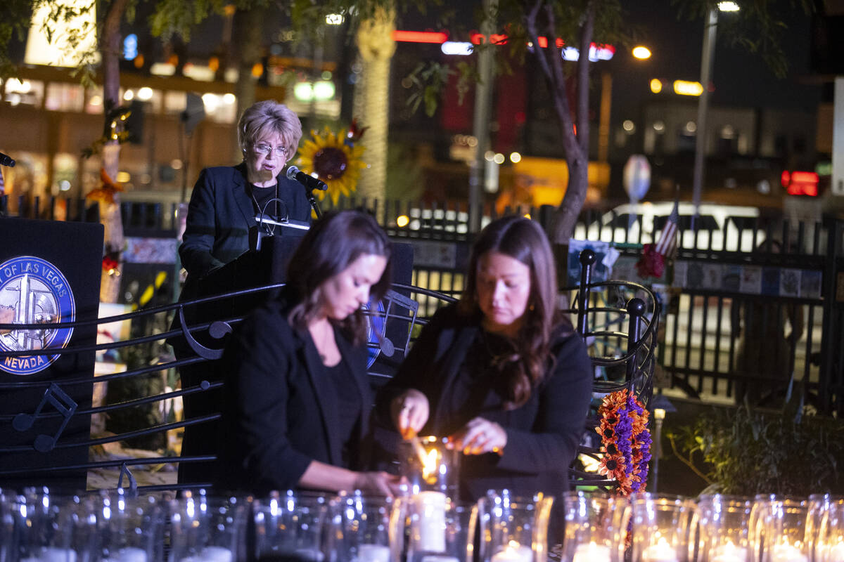 Las Vegas Mayor Carolyn Goodman, from left, reads the names of the victims from 1 October while ...