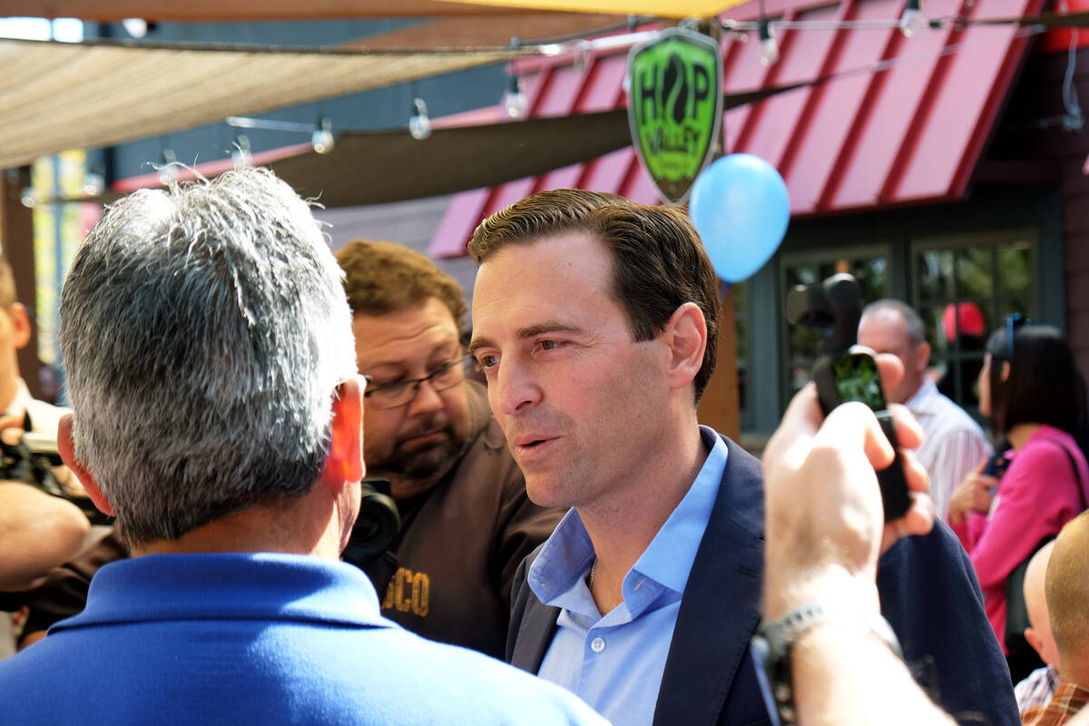 Republican Senate candidate Adam Laxalt greeted supporters Friday at a Reno restaurant before b ...