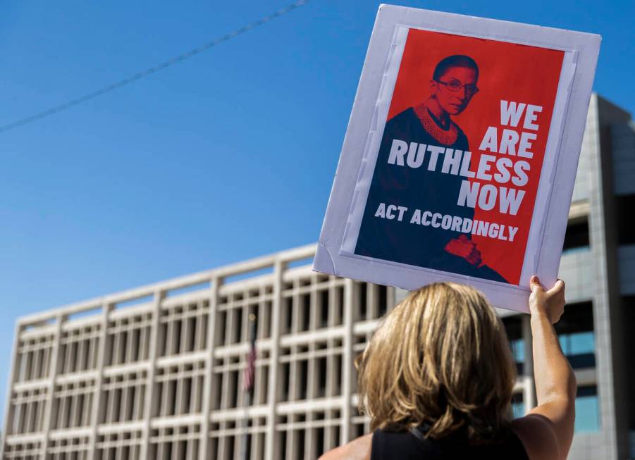 Demonstrators gather outside the Lloyd D George Courthouse during a March for Reproductive Righ ...