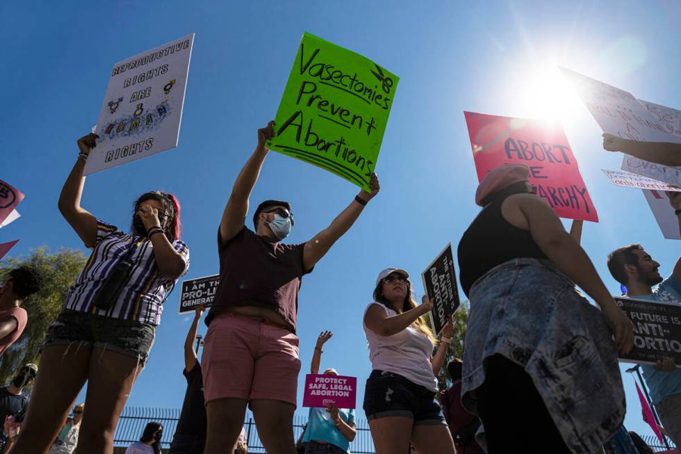 Demonstrators gather outside the Lloyd D George Courthouse during a March for Reproductive Righ ...