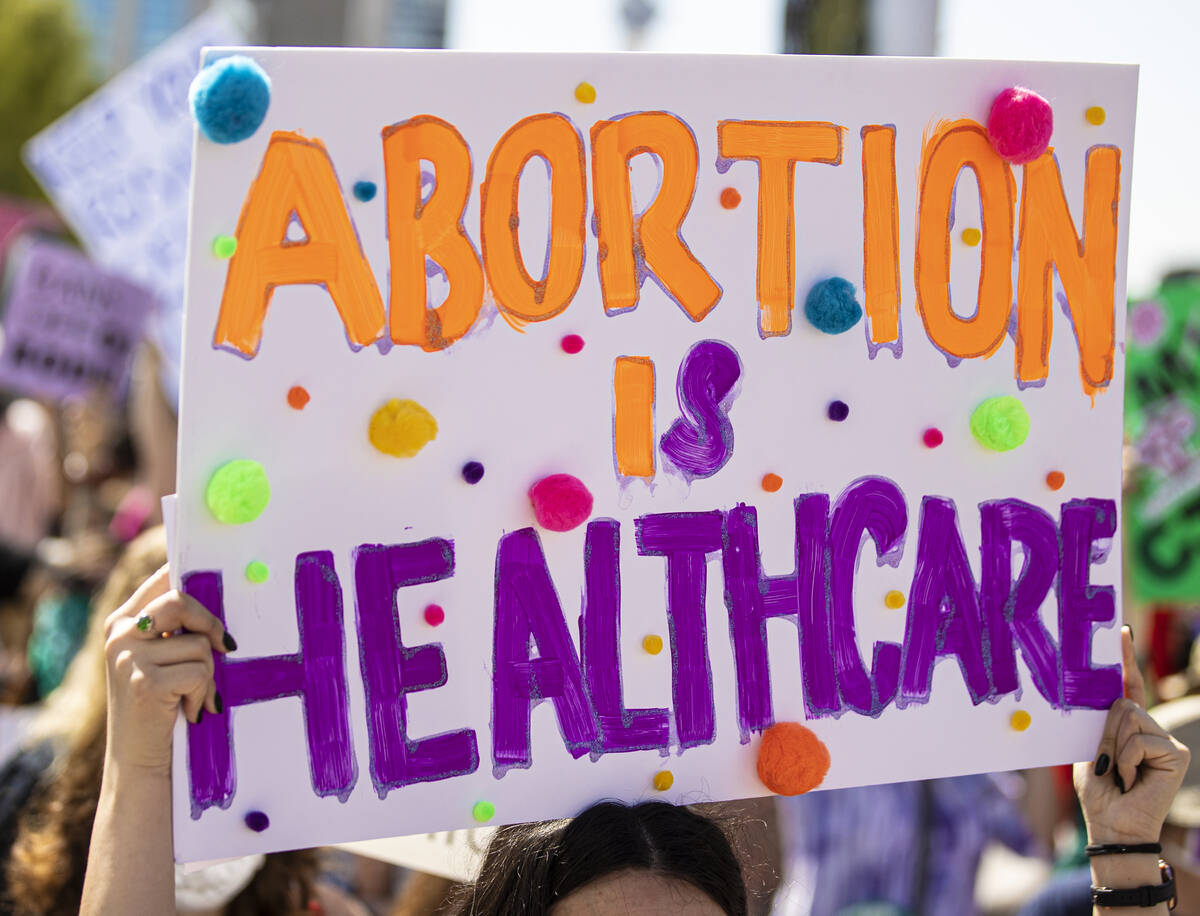 Demonstrators gather outside the Lloyd D George Courthouse during a March for Reproductive Righ ...