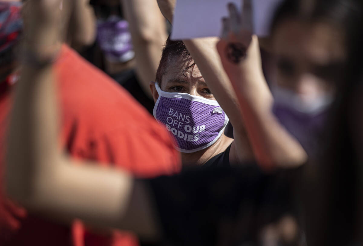 Demonstrators gather outside the Lloyd D George Courthouse during a March for Reproductive Righ ...