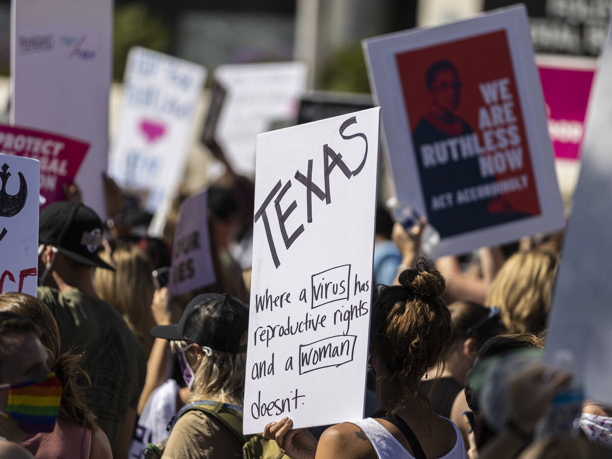 Demonstrators gather outside the Lloyd D George Courthouse during a March for Reproductive Righ ...