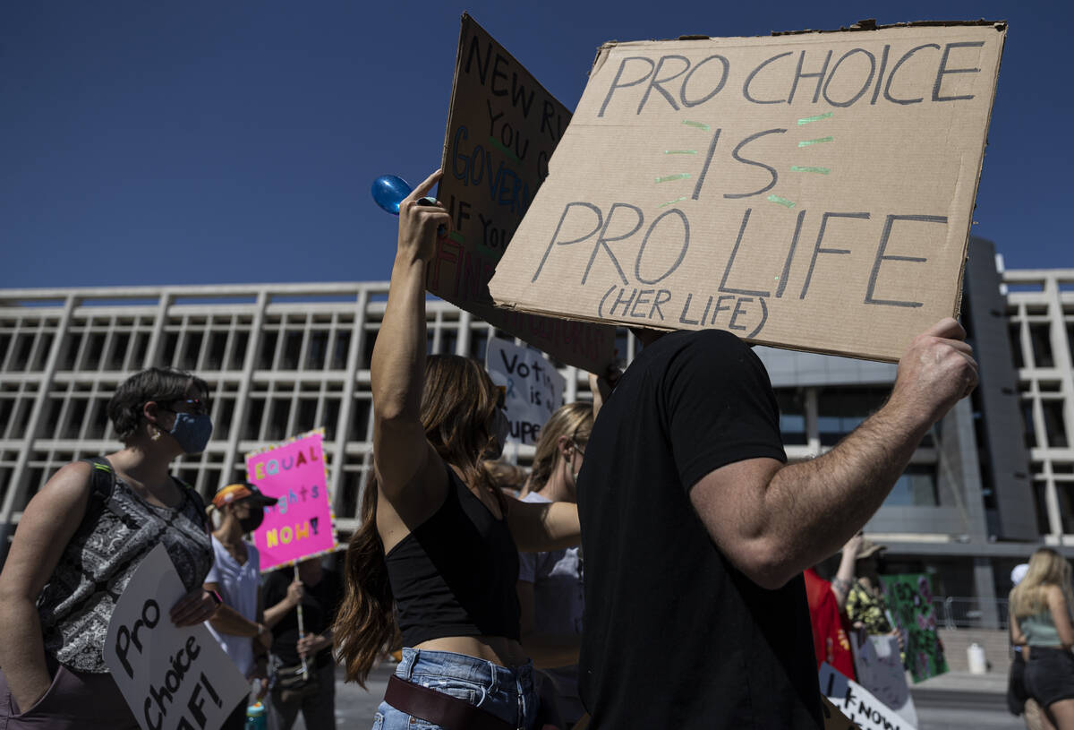 Demonstrators gather outside the Lloyd D George Courthouse during a March for Reproductive Righ ...