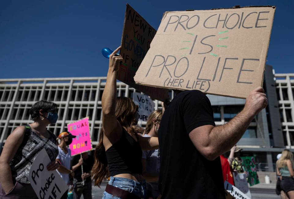 Demonstrators gather outside the Lloyd D George Courthouse during a March for Reproductive Righ ...