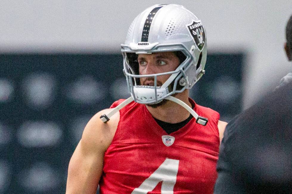 Raiders quarterback Derek Carr (4) looks on during a practice session at the Raiders Headquarte ...