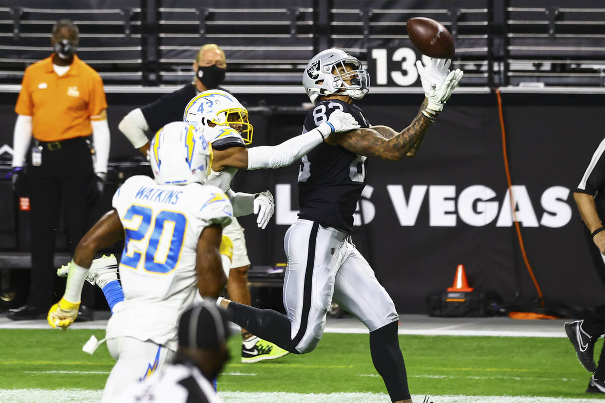 Raiders tight end Darren Waller (83) makes the catch on the way to score a touchdown past Los A ...
