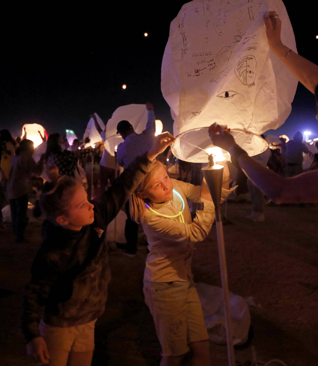 Luvia Williams, 8, of Scottsdale Ariz., left and her brother Loxly, 11 prepare their lantern fo ...