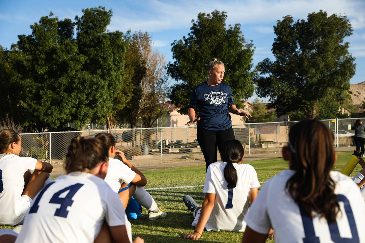 Shadow Ridge head coach Kalah Williams talks to her team during halftime in a game against Dese ...