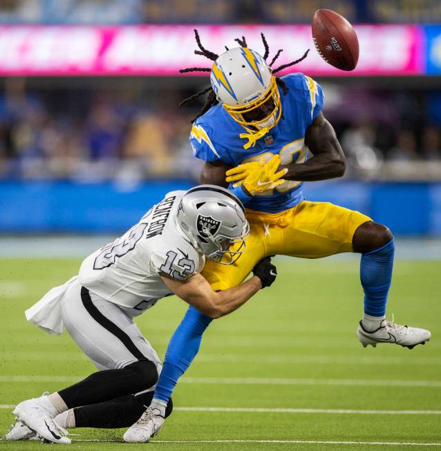 Raiders wide receiver Hunter Renfrow (13) breaks up a pass attempt to Los Angeles Chargers defe ...