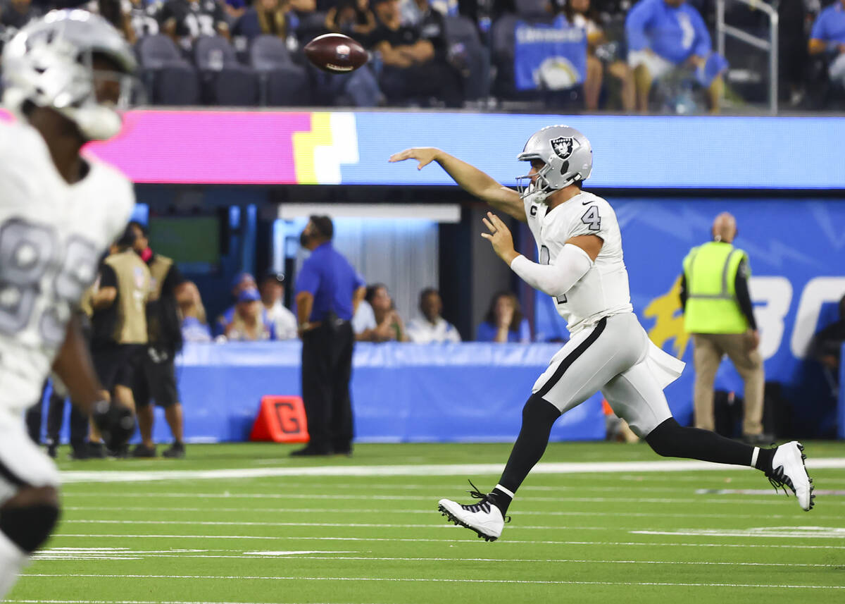 Raiders quarterback Derek Carr (4) throws a pass during the second half of an NFL game against ...